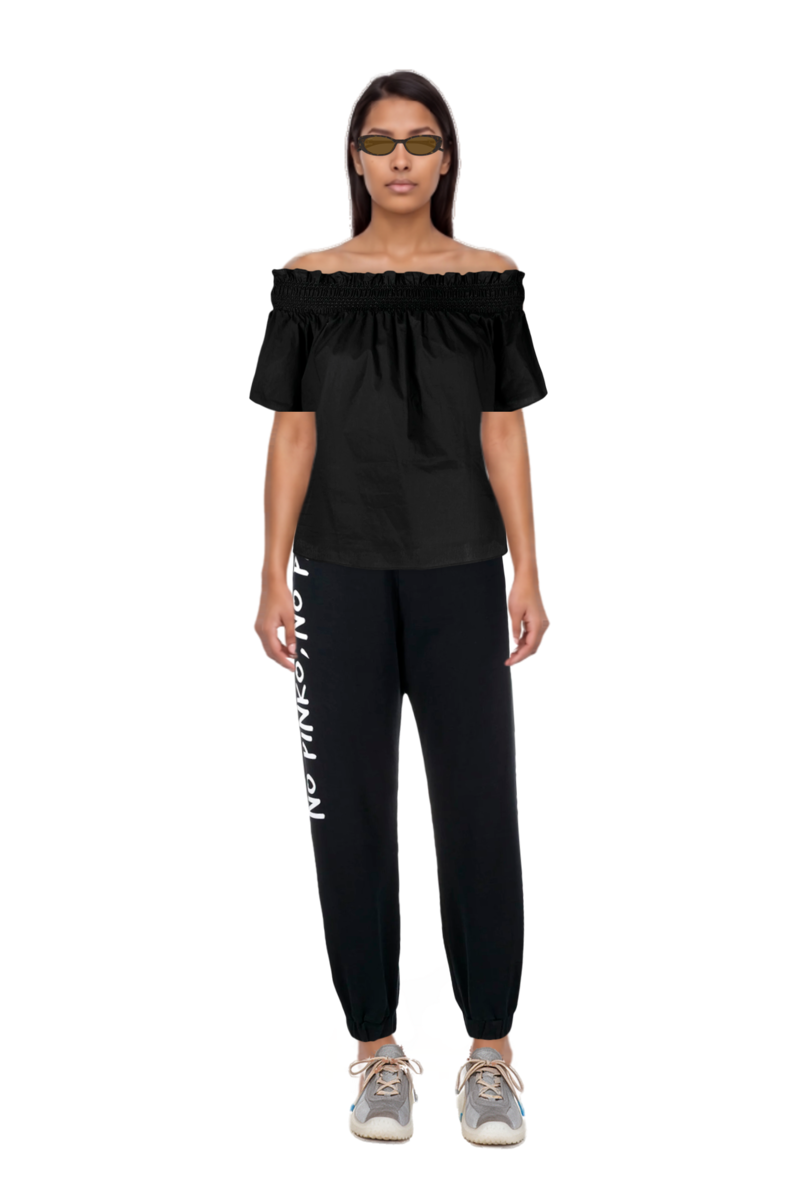 Outfit bubble technical fabric and suede sneakers and oval-frame sunglasses