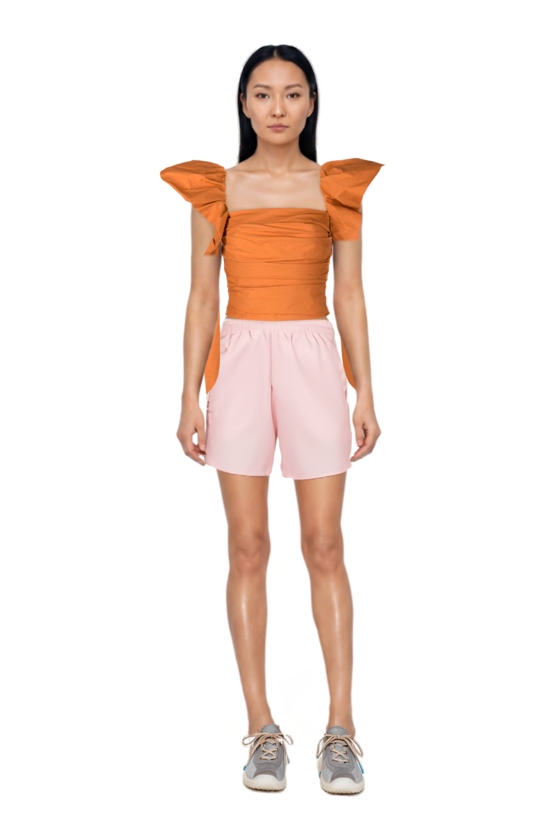Outfit nylon shorts and bubble technical fabric and suede sneakers