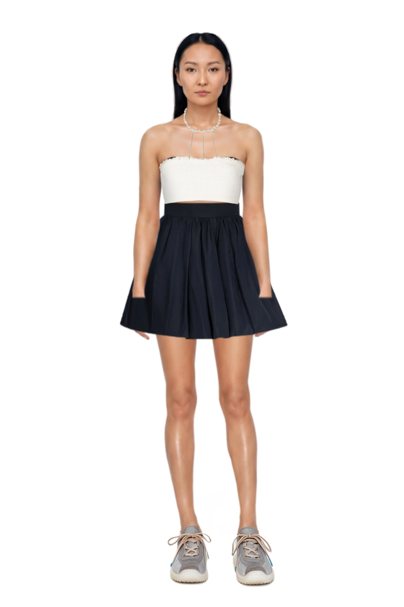 Outfit bloomer mini skirt and bubble technical fabric and suede sneakers